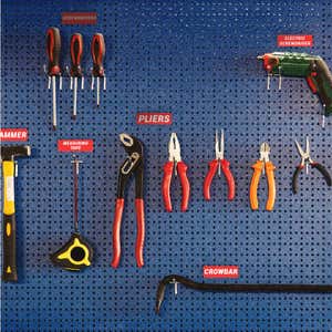 Small engraved plastic signs used to label tools