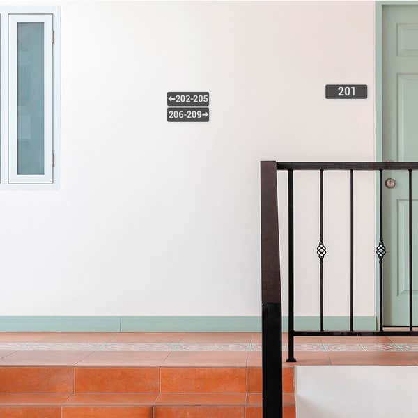 Gray 2 by 6 Plastic Signs Showing Room Numbers