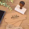 Custom wood stamp creating bakery logo impression