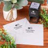 Address stamp impression with american flag above address on two envleopes